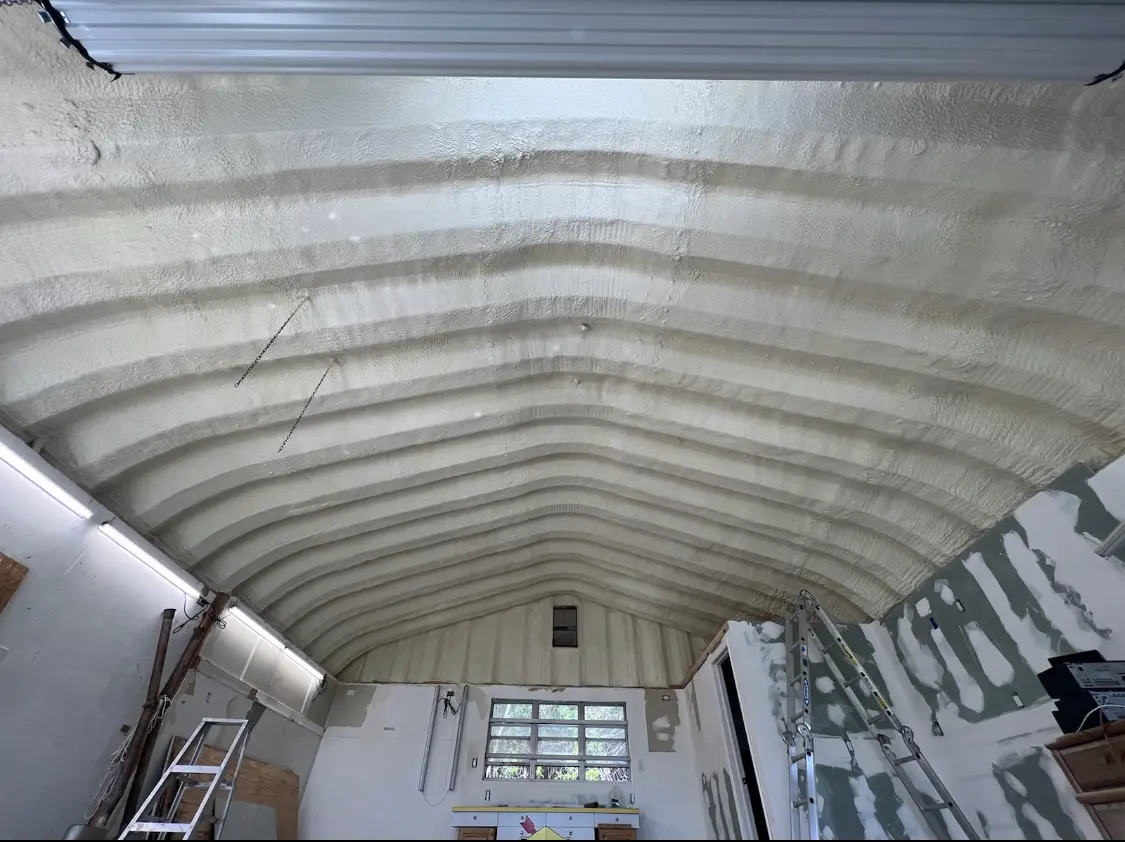 Spray polyurethane foam applied to the underside of a metal roof deck in Winchester